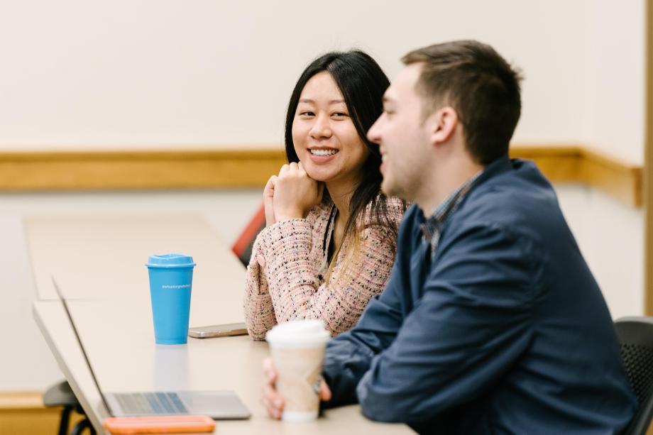 Two Wheaton College Graduate students in class