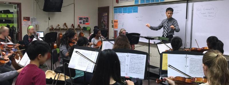 orchestra teacher at the white board