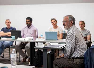 Some adult students in a class