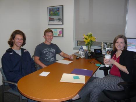 Candice advising two male students in her office