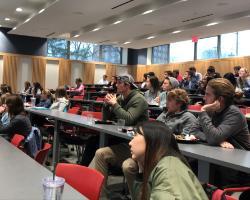 Students seated listening to lecture