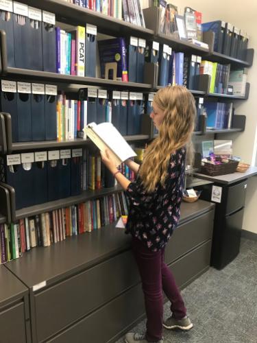 Female student infront of Resource Center library