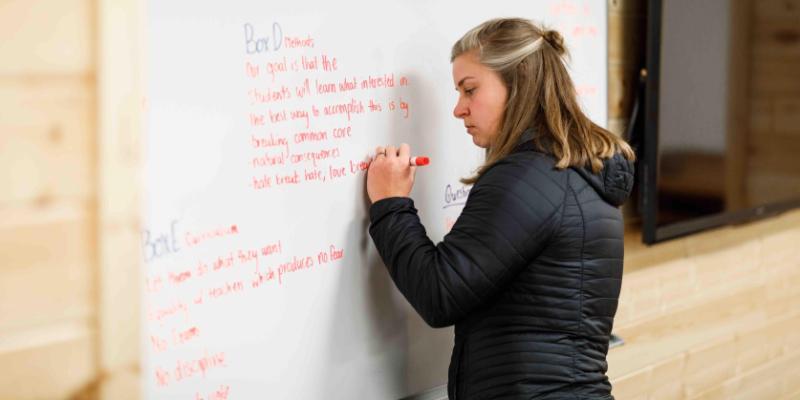 kayle glore writing on whiteboard