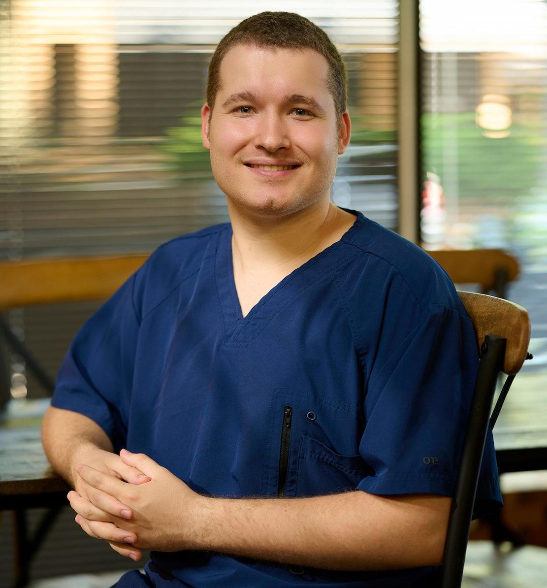 Joshua Clark Wheaton College nursing scrubs
