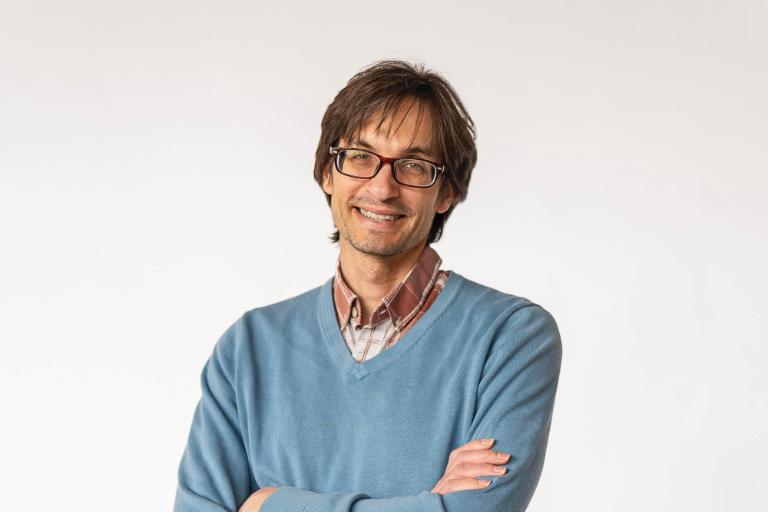 Wheaton College psychology doctoral candidate Thomas Douce in a blue sweater