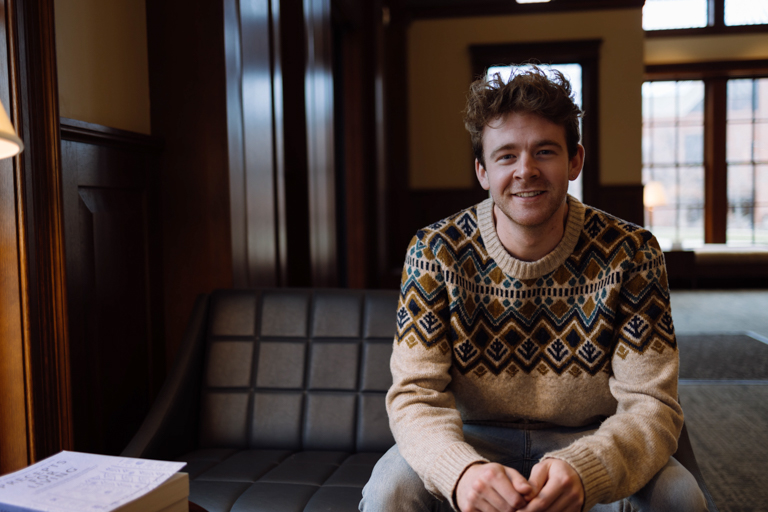 Wheaton College IL Undergraduate Transfer Student Josh Winnes in the Melvin E. Banks Welcome Center