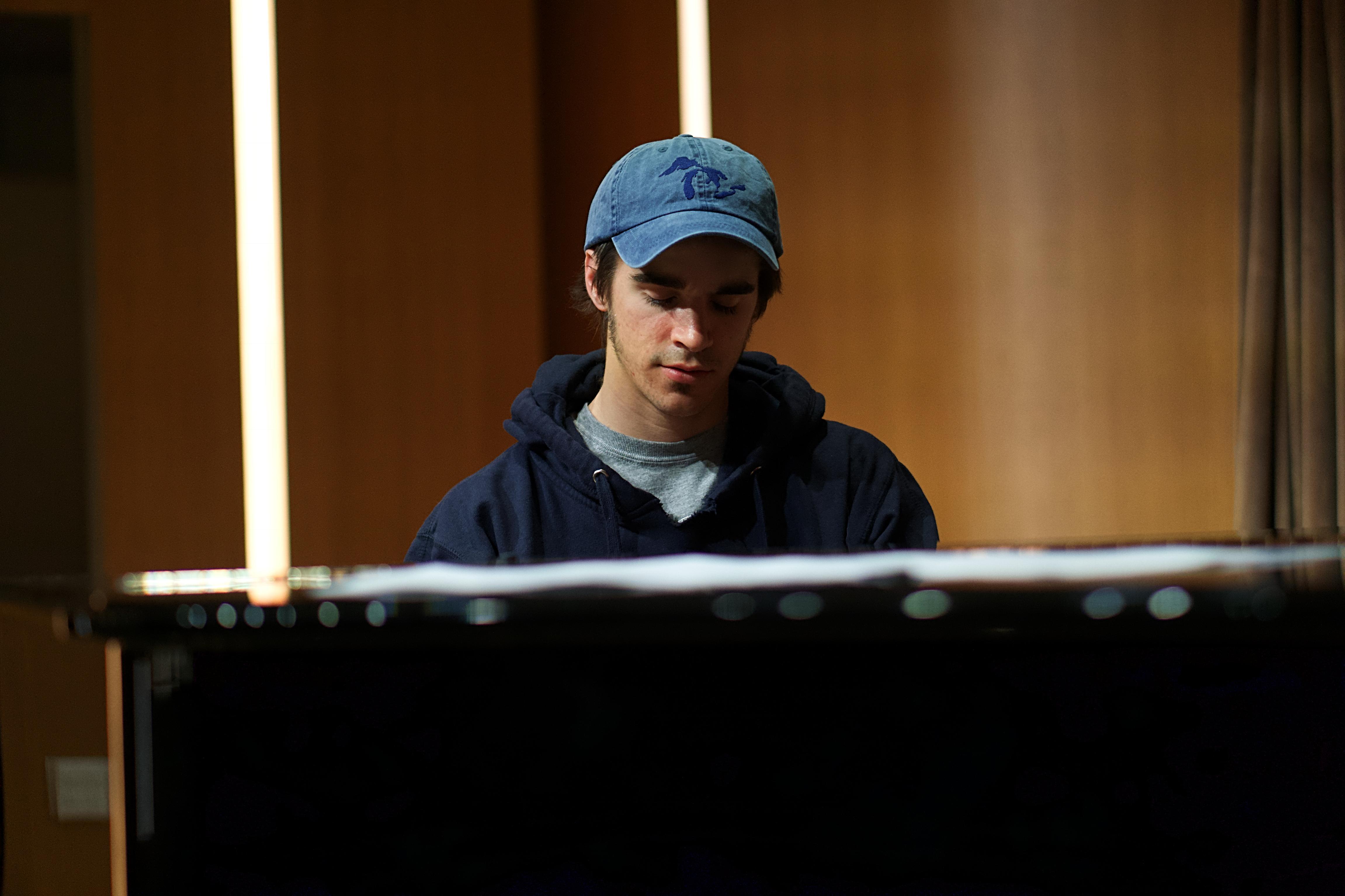 Close up photo of Jesse Dunn playing the piano