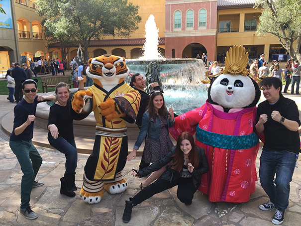 Students posing with Kung Fu Panda characters at Dreamworks